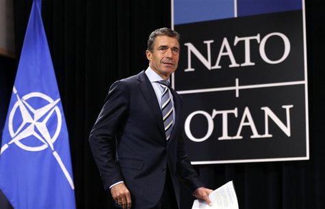 NATO Secretary General Anders Fogh Rasmussen arrives to address a news conference during a NATO defence ministers meeting at the Alliance he NATO Secretary General Anders Fogh Rasmussen arrives to address a news conference during a NATO defence ministers meeting at the Alliance he