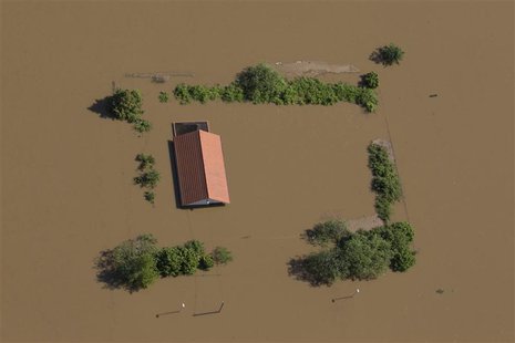 A house stands almost fully immersed in the water of the Elbe near the city of Meissen after the river broke its bank during a flood, June 5 A house stands almost fully immersed in the water of the Elbe near the city of Meissen after the river broke its bank during a flood, June 5