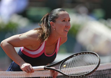 Jelena Jankovic of Serbia checks a line call during her women's singles quarter-final match against Maria Sharapova of Russia at the French Jelena Jankovic of Serbia checks a line call during her women's singles quarter-final match against Maria Sharapova of Russia at the French