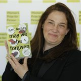 A.M. Homes, author of "May We Be Forgiven", poses for photographers before the announcement of the 2013 Women's Prize for Fiction at the Roy A.M. Homes, author of "May We Be Forgiven", poses for photographers before the announcement of the 2013 Women's Prize for Fiction at the Roy