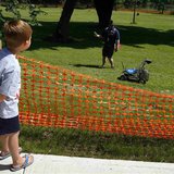Five-year-old Brady Chapman watches a robot from Kuukulgur team from Estonia compete in NASA's 2013 Sample Return Robot Challenge at the Wor Five-year-old Brady Chapman watches a robot from Kuukulgur team from Estonia compete in NASA's 2013 Sample Return Robot Challenge at the Wor