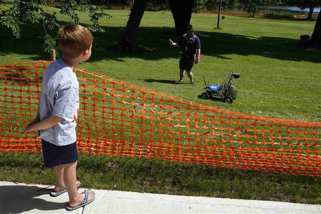 Five-year-old Brady Chapman watches a robot from Kuukulgur team from Estonia compete in NASA's 2013 Sample Return Robot Challenge at the Wor Five-year-old Brady Chapman watches a robot from Kuukulgur team from Estonia compete in NASA's 2013 Sample Return Robot Challenge at the Wor
