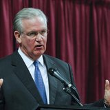 Missouri Governor Jay Nixon participates in a debate with David Spence at the Holiday Inn Executive Center in Columbia, Missouri, September 