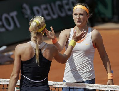 Victoria Azarenka (R) of Belarus shakes hands with Maria Kirilenko of Russia after their women's singles quarter-final match during the Fren Victoria Azarenka (R) of Belarus shakes hands with Maria Kirilenko of Russia after their women's singles quarter-final match during the Fren