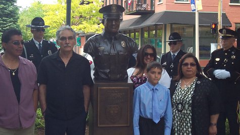 The new statue surrounded by members of the Zapata family, who are surrounded by the Public Safety Department's Honor Guard. The new statue surrounded by members of the Zapata family, who are surrounded by the Public Safety Department's Honor Guard.