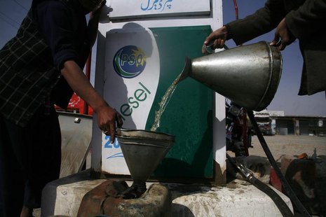 A man fills a canister with petrol that he says was brought from Iran, at a roadside petrol station on the outskirts of Quetta February 13, A man fills a canister with petrol that he says was brought from Iran, at a roadside petrol station on the outskirts of Quetta February 13,