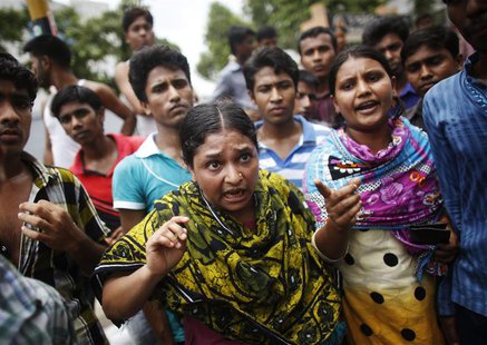 Garment workers block a street as they participate in a protest in Dhaka June 5, 2013. REUTERS/Andrew Biraj Garment workers block a street as they participate in a protest in Dhaka June 5, 2013. REUTERS/Andrew Biraj