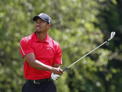 Tiger Woods of the U.S. watches his second shot on the 10th hole during the final round of the Memorial Tournament at Muirfield Village Golf Tiger Woods of the U.S. watches his second shot on the 10th hole during the final round of the Memorial Tournament at Muirfield Village Golf
