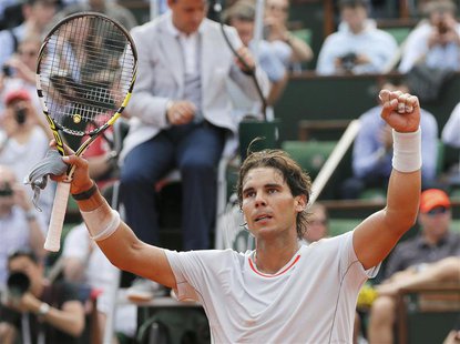 Rafael Nadal of Spain celebrates defeating Stanislas Wawrinka of Switzerland in their men's singles quarter-final match during the French Op Rafael Nadal of Spain celebrates defeating Stanislas Wawrinka of Switzerland in their men's singles quarter-final match during the French Op