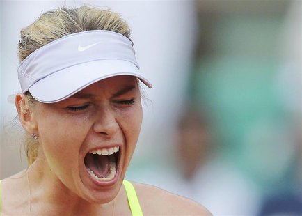 Maria Sharapova of Russia reacts during her women's singles semi-final match against Victoria Azarenka of Belarus at the French Open tennis Maria Sharapova of Russia reacts during her women's singles semi-final match against Victoria Azarenka of Belarus at the French Open tennis