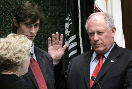 Pat Quinn (R) is sworn in as Governor of Illinois by Appellate Judge Anne Burke while son Patrick IV looks on, after the removal of impeache Pat Quinn (R) is sworn in as Governor of Illinois by Appellate Judge Anne Burke while son Patrick IV looks on, after the removal of impeache