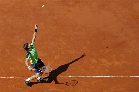 David Ferrer of Spain serves to compatriot Tommy Robredo during their men's singles quarter-final match at the French Open tennis tournament David Ferrer of Spain serves to compatriot Tommy Robredo during their men's singles quarter-final match at the French Open tennis tournament
