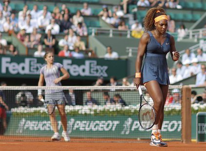 Serena Williams of the U.S. pumps her fist during her women's singles semi-final match against Sara Errani of Italy (L) at the French Open t Serena Williams of the U.S. pumps her fist during her women's singles semi-final match against Sara Errani of Italy (L) at the French Open t