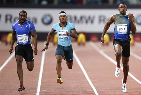 Usain Bolt of Jamaica (R) competes with Justin Gatlin of the U.S. (L) during the men's 100m event at the Golden Gala IAAF Diamond League at Usain Bolt of Jamaica (R) competes with Justin Gatlin of the U.S. (L) during the men's 100m event at the Golden Gala IAAF Diamond League at