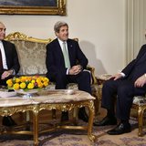 Egyptian Foreign Minister Mohammed Kamel Amr (L), sits with U.S. Secretary of State John Kerry, and Egyptian President Mohamed Mursi (R) dur