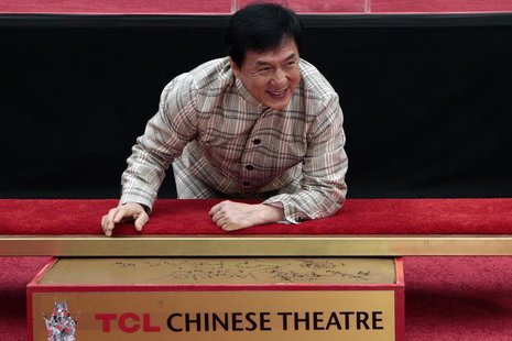 Actor Jackie Chan poses during a hand and footprint ceremony at the TCL Chinese Theatre in Hollywood, California, June 6, 2013. REUTERS/Jona Actor Jackie Chan poses during a hand and footprint ceremony at the TCL Chinese Theatre in Hollywood, California, June 6, 2013. REUTERS/Jona