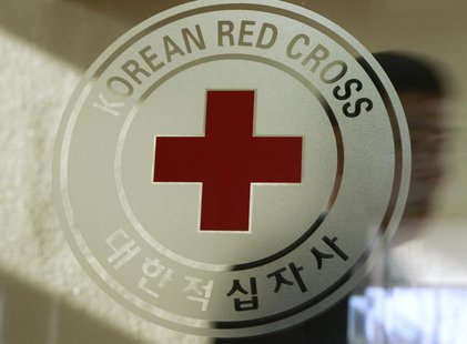 A man walks past a logo of the South Korean Red Cross at its headquarters in Seoul February 9, 2011. REUTERS/Truth Leem A man walks past a logo of the South Korean Red Cross at its headquarters in Seoul February 9, 2011. REUTERS/Truth Leem