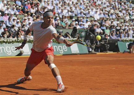 Rafael Nadal of Spain hits a return to Novak Djokovic of Serbia during their men's singles semi-final match at the French Open tennis tourna Rafael Nadal of Spain hits a return to Novak Djokovic of Serbia during their men's singles semi-final match at the French Open tennis tourna