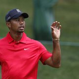 Tiger Woods of the U.S. catches his ball before making a par on the 11th hole during the final round of the Memorial Tournament at Muirfield