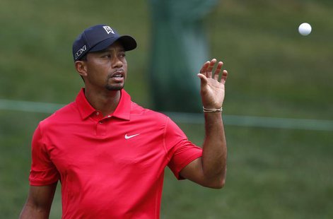 Tiger Woods of the U.S. catches his ball before making a par on the 11th hole during the final round of the Memorial Tournament at Muirfield Tiger Woods of the U.S. catches his ball before making a par on the 11th hole during the final round of the Memorial Tournament at Muirfield