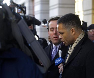 Former U.S. Rep. Jesse Jackson, Jr. (D-IL) (R) departs the U.S. District Federal Courthouse in Washington February 20, 2013. REUTERS/Gary Ca Former U.S. Rep. Jesse Jackson, Jr. (D-IL) (R) departs the U.S. District Federal Courthouse in Washington February 20, 2013. REUTERS/Gary Ca