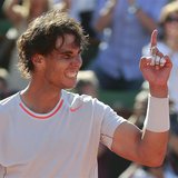 Rafael Nadal of Spain celebrates defeating Novak Djokovic of Serbia in their men's singles semi-final match during the French Open tennis to