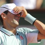 Novak Djokovic of Serbia reacts during his men's singles semi-final match against Rafael Nadal of Spain at the French Open tennis tournament