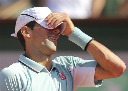 Novak Djokovic of Serbia reacts during his men's singles semi-final match against Rafael Nadal of Spain at the French Open tennis tournament Novak Djokovic of Serbia reacts during his men's singles semi-final match against Rafael Nadal of Spain at the French Open tennis tournament
