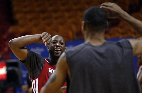 Miami Heat players Dwyane Wade (L) and Rashard Lewis react during a team practice ahead of Game 2 of the NBA Finals basketball playoff again Miami Heat players Dwyane Wade (L) and Rashard Lewis react during a team practice ahead of Game 2 of the NBA Finals basketball playoff again