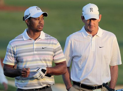 Tiger Woods (L) of the U.S. walks off the driving range with his swing coach Hank Haney (R) before his practice round for the 2010 Masters g Tiger Woods (L) of the U.S. walks off the driving range with his swing coach Hank Haney (R) before his practice round for the 2010 Masters g