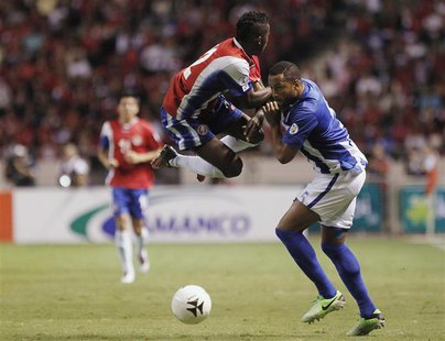 Costa Rica's Joel Campbell (L) fights for the ball with Honduras' Victor Bernardez during their 2014 World Cup qualifying soccer match at th Costa Rica's Joel Campbell (L) fights for the ball with Honduras' Victor Bernardez during their 2014 World Cup qualifying soccer match at th