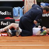 Andy Murray of Britain receives medical care during his match against Marcel Granollers of Spain at the Rome Masters tennis tournament May 1