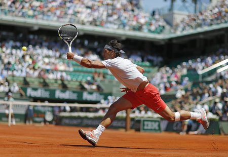 Rafael Nadal of Spain hits a return to Novak Djokovic of Serbia during their men's singles semi-final match at the French Open tennis tourna Rafael Nadal of Spain hits a return to Novak Djokovic of Serbia during their men's singles semi-final match at the French Open tennis tourna