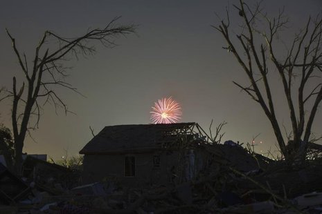 Memorial Day fireworks explode over a house damaged by the May 20 afternoon tornado in Moore, Oklahoma May 26, 2013. REUTERS/Lucas Jackson Memorial Day fireworks explode over a house damaged by the May 20 afternoon tornado in Moore, Oklahoma May 26, 2013. REUTERS/Lucas Jackson