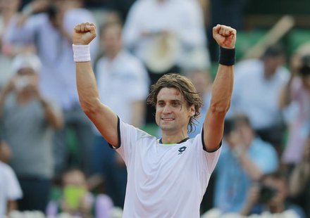 David Ferrer of Spain celebrates defeating Jo-Wilfried Tsonga of France in their men's singles semi-final match during the French Open tenni David Ferrer of Spain celebrates defeating Jo-Wilfried Tsonga of France in their men's singles semi-final match during the French Open tenni