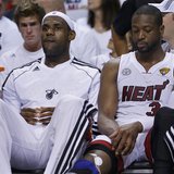 Miami Heat's LeBron James (L) and Dwyane Wade sit on the bench against the San Antonio Spurs during the third quarter in Game 1 of their NBA Miami Heat's LeBron James (L) and Dwyane Wade sit on the bench against the San Antonio Spurs during the third quarter in Game 1 of their NBA