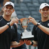 Bob Bryan and Mike Bryan of the U.S. pose with their trophy after defeating Michael Llodra and Nicolas Mahut of France in their men's double Bob Bryan and Mike Bryan of the U.S. pose with their trophy after defeating Michael Llodra and Nicolas Mahut of France in their men's double
