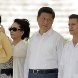 China's first lady Peng Liyuan (2nd L) takes a photograph as China's President Xi Jinping (2nd R) talks with his Mexican counterpart Enrique
