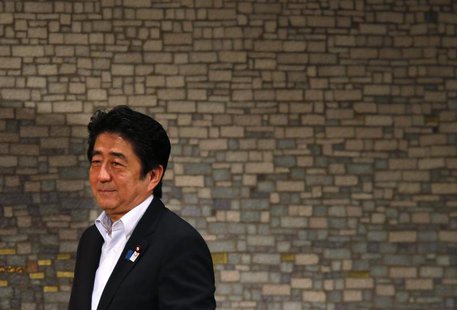 Japan's Prime Minister Shinzo Abe smiles as he arrives at a seminar in Tokyo June 5, 2013. REUTERS/Toru Hanai Japan's Prime Minister Shinzo Abe smiles as he arrives at a seminar in Tokyo June 5, 2013. REUTERS/Toru Hanai