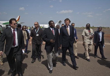 Bert Koenders (center R), United Nations special envoy for Mali, is greeted by Mali's foreign affairs General Secretary Sekouba Cisse (cente Bert Koenders (center R), United Nations special envoy for Mali, is greeted by Mali's foreign affairs General Secretary Sekouba Cisse (cente