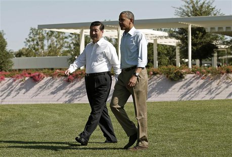 U.S. President Barack Obama and Chinese President Xi Jinping (L) walk the grounds at The Annenberg Retreat at Sunnylands in Rancho Mirage, C U.S. President Barack Obama and Chinese President Xi Jinping (L) walk the grounds at The Annenberg Retreat at Sunnylands in Rancho Mirage, C