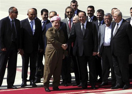Iraqi Prime Minister Nuri al-Maliki (centre R) shakes hands with Iraqi Kurdish President Masoud Barzani (centre L) in Arbil, about 350 km (2 Iraqi Prime Minister Nuri al-Maliki (centre R) shakes hands with Iraqi Kurdish President Masoud Barzani (centre L) in Arbil, about 350 km (2