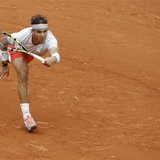 Rafael Nadal of Spain hits a return to compatriot David Ferrer during their men's singles final match at the French Open tennis tournament a Rafael Nadal of Spain hits a return to compatriot David Ferrer during their men's singles final match at the French Open tennis tournament a
