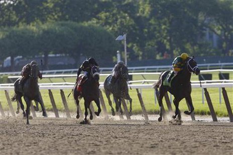 Palace Malice (R), with jockey Mike Smith in the irons, takes the lead to win the 145th running of the Belmont Stakes, the final leg of horse racing's triple crown, at Belmont Park in Elmont, New York, June 8, 2013.
REUTERS/Chip East Palace Malice (R), with jockey Mike Smith in the irons, takes the lead to win the 145th running of the Belmont Stakes, the final leg of horse racing's triple crown, at Belmont Park in Elmont, New York, June 8, 2013.
REUTERS/Chip East