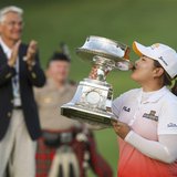 Inbee Park of South Korea kisses the trophy after winning the LPGA Golf Championship in Pittsford, New York June 9, 2013. REUTERS/Adam Fenst