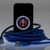 An illustration picture shows the logo of the U.S. National Security Agency on the display of an iPhone in Berlin, June 7, 2013. REUTERS/Paw
