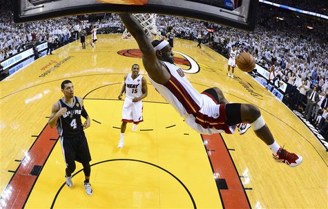 Miami Heat's LeBron James dunks on San Antonio Spurs Danny Green (4) during Game 2 of their NBA Finals basketball playoff in Miami, Florida Miami Heat's LeBron James dunks on San Antonio Spurs Danny Green (4) during Game 2 of their NBA Finals basketball playoff in Miami, Florida