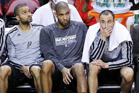 San Antonio Spurs' Tony Parker (L), Tim Duncan (C), and Manu Ginobili sit on the bench during their loss to the Miami Heat in Game 2 of thei San Antonio Spurs' Tony Parker (L), Tim Duncan (C), and Manu Ginobili sit on the bench during their loss to the Miami Heat in Game 2 of thei