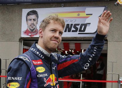 Red Bull Formula One driver Sebastian Vettel of Germany waves during the first practice session of the Canadian F1 Grand Prix at the Circuit Red Bull Formula One driver Sebastian Vettel of Germany waves during the first practice session of the Canadian F1 Grand Prix at the Circuit
