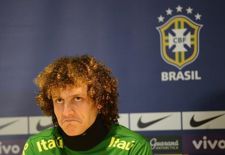 Brazil's football player David Luiz listens to questions during a news conference ahead of a friendly soccer match against Russia at Stamfor Brazil's football player David Luiz listens to questions during a news conference ahead of a friendly soccer match against Russia at Stamfor